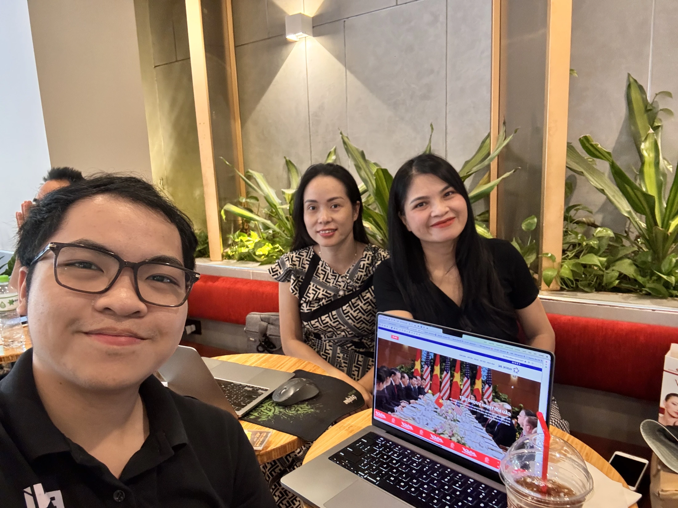 A meeting and discussion around a computer